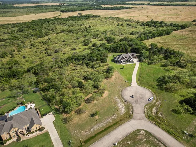 a view of a field with an ocean view