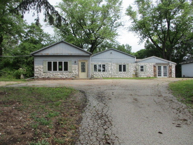 28420 West Big Hollow Road Ingleside, IL 60041 - Photo 1 of 25 a front view of a house with yard
