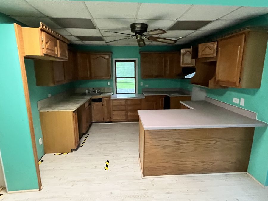 28420 West Big Hollow Road Ingleside, IL 60041 - Photo 13 of 25 a kitchen with a refrigerator a sink and a cabinets