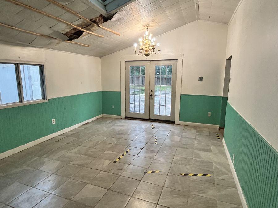 28420 West Big Hollow Road Ingleside, IL 60041 - Photo 18 of 25 a view of an empty room with a window and chandelier
