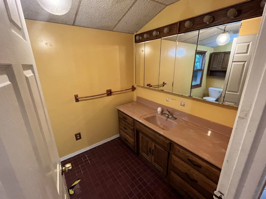 28420 West Big Hollow Road Ingleside, IL 60041 - Photo 19 of 25 a bathroom with a sink and a mirror