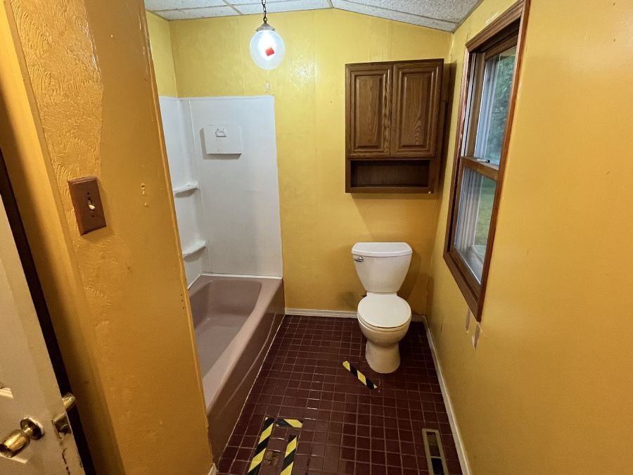 28420 West Big Hollow Road Ingleside, IL 60041 - Photo 20 of 25 a bathroom with a granite countertop toilet and a shower