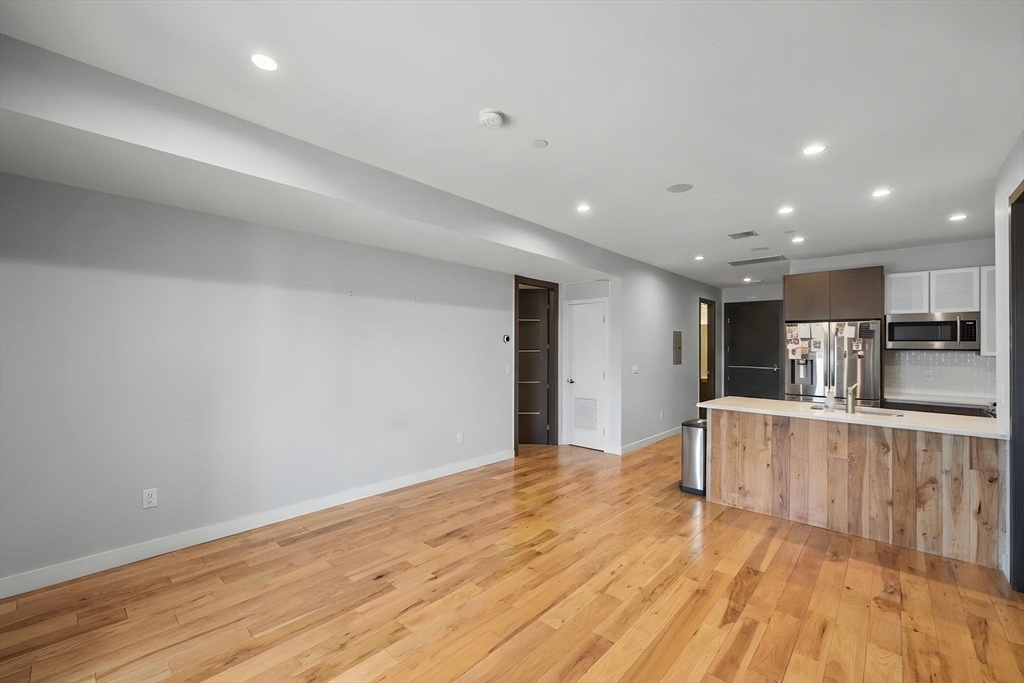 39 Lexington Street, Unit 5 Boston, MA 02128 - Photo 1 of 28 a view of kitchen with wooden floor