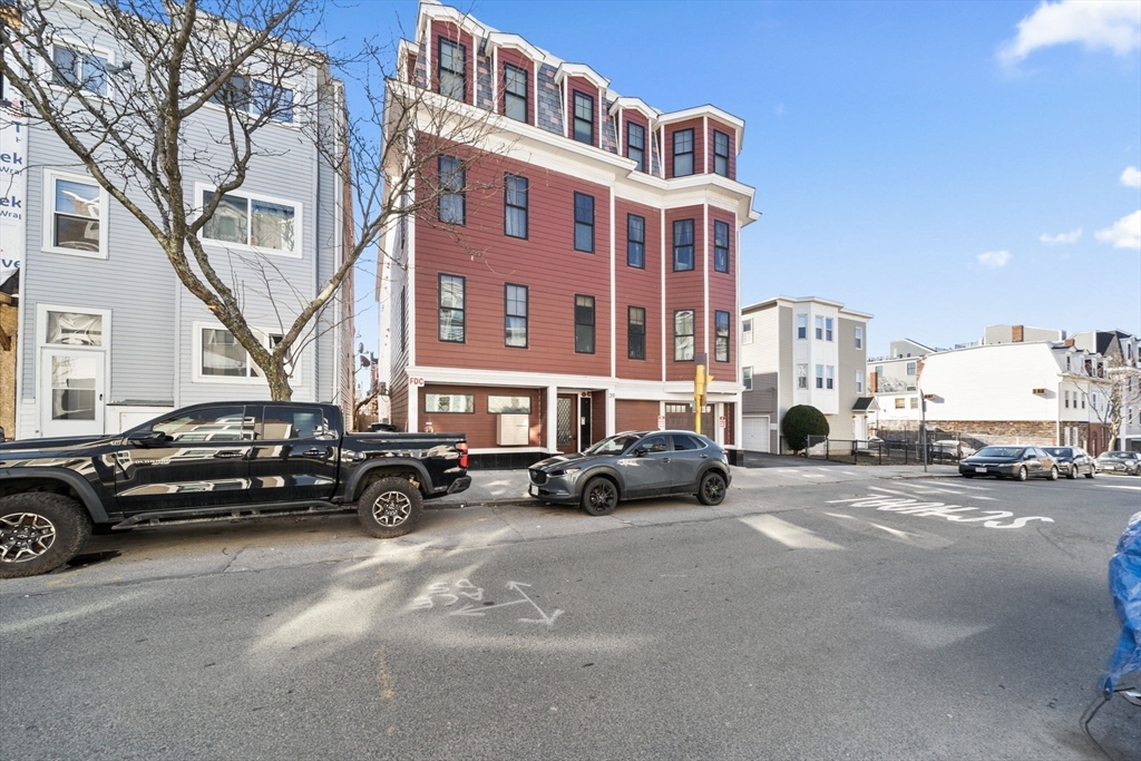 39 Lexington Street, Unit 5 Boston, MA 02128 - Photo 26 of 28 a car parked in front of a building