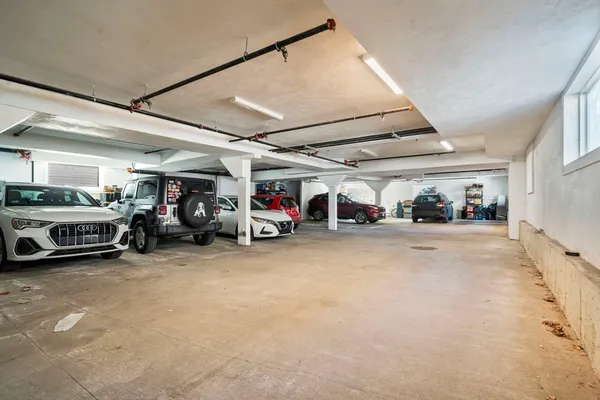 a view of a garage with cars