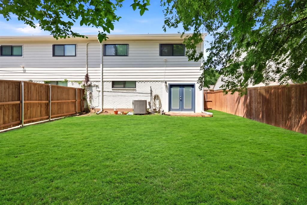 7354 Walling Lane Dallas, TX 75231 - Photo 24 of 28 a view of a house with backyard and a tree