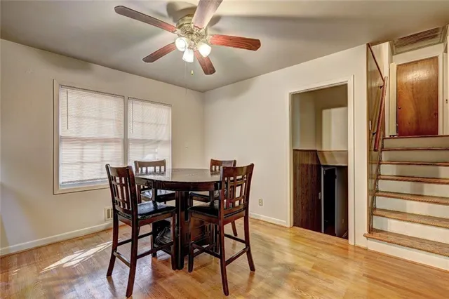 a view of a dining room with furniture and window
