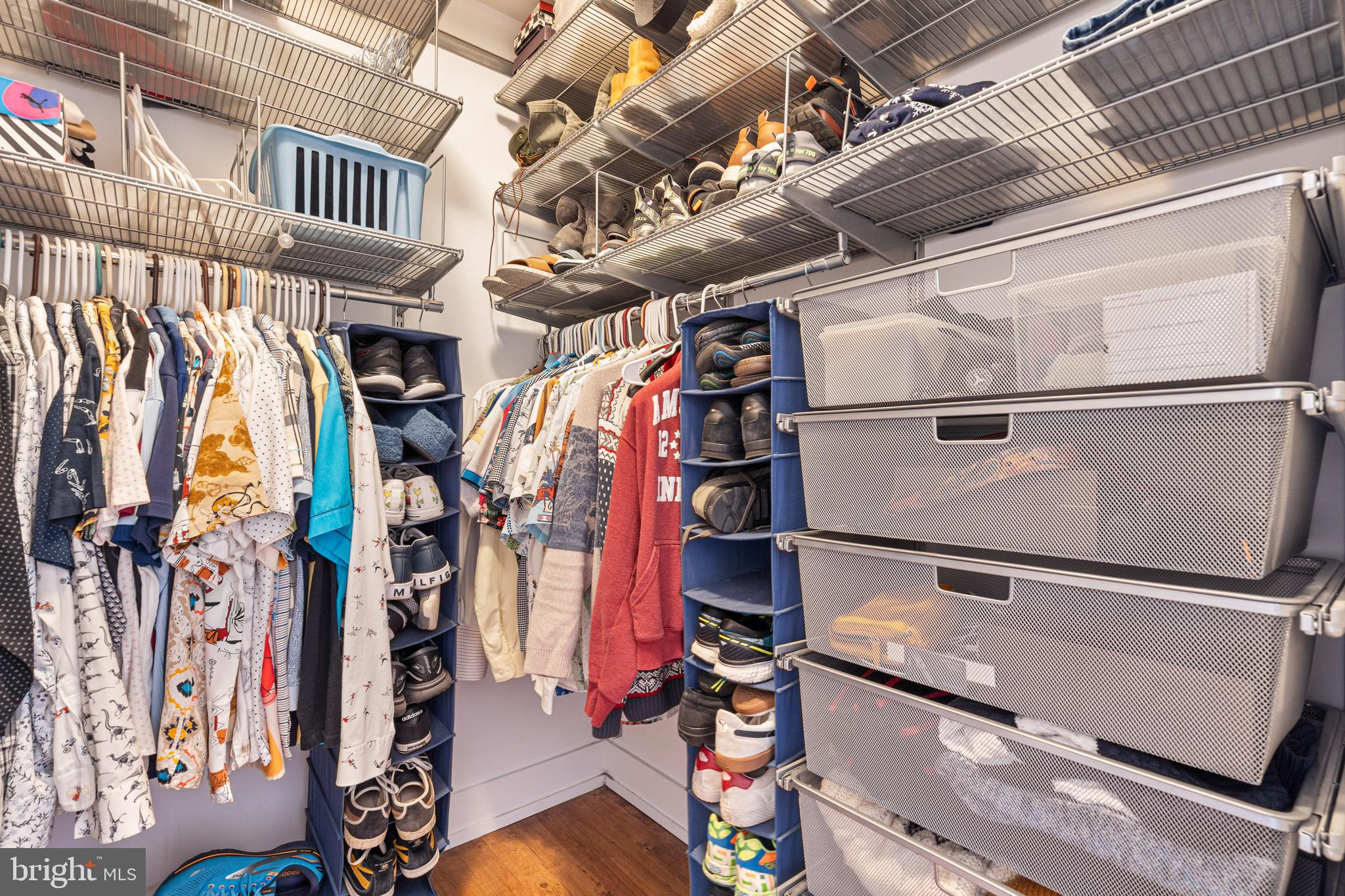 1700 Kalorama Road Northwest, Unit PH502 Washington, DC 20009 - Photo 19 of 50 a view of walk in closet with clothes and shoes
