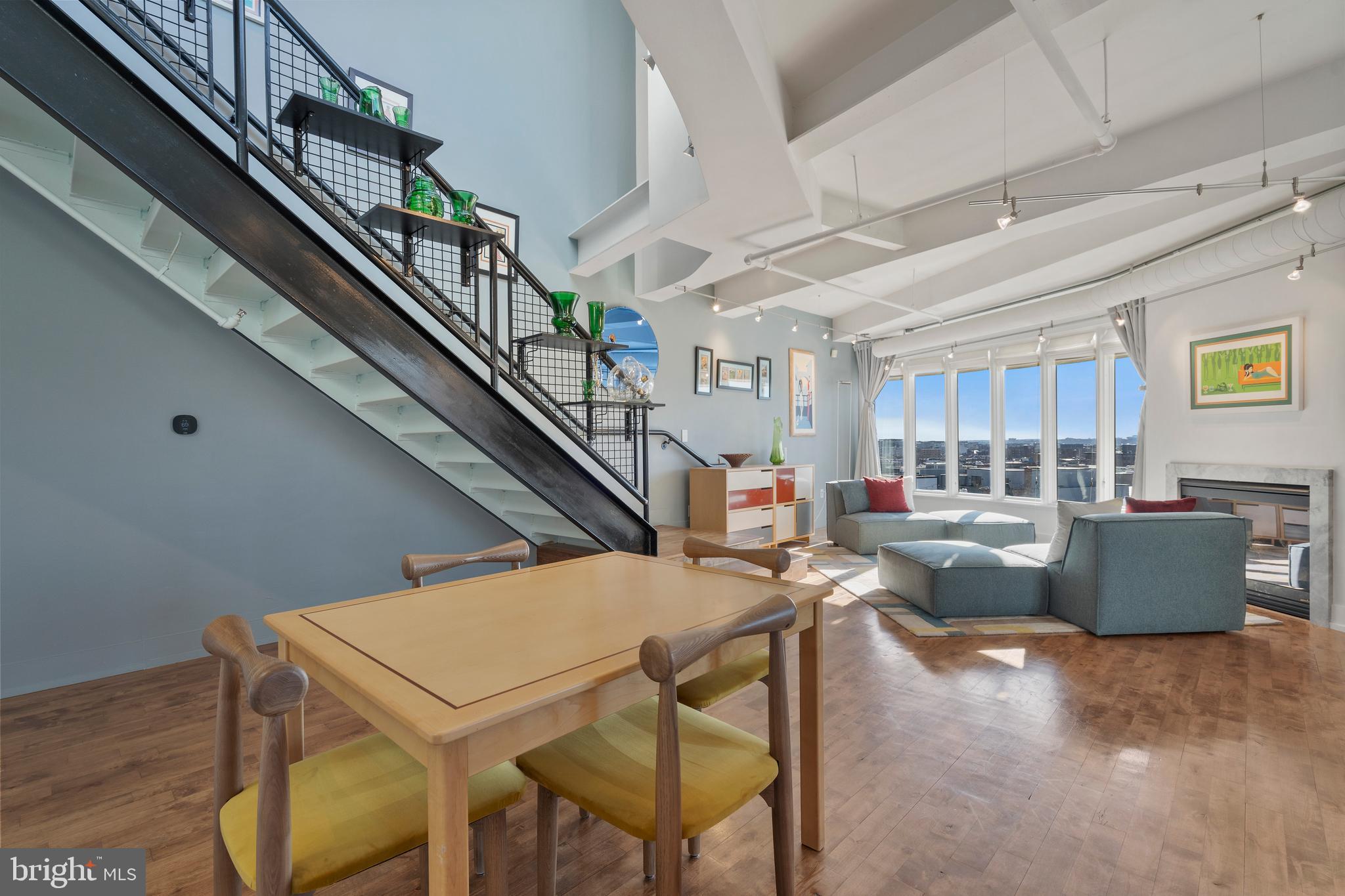1700 Kalorama Road Northwest, Unit PH502 Washington, DC 20009 - Photo 29 of 50 a living room with furniture and a large window