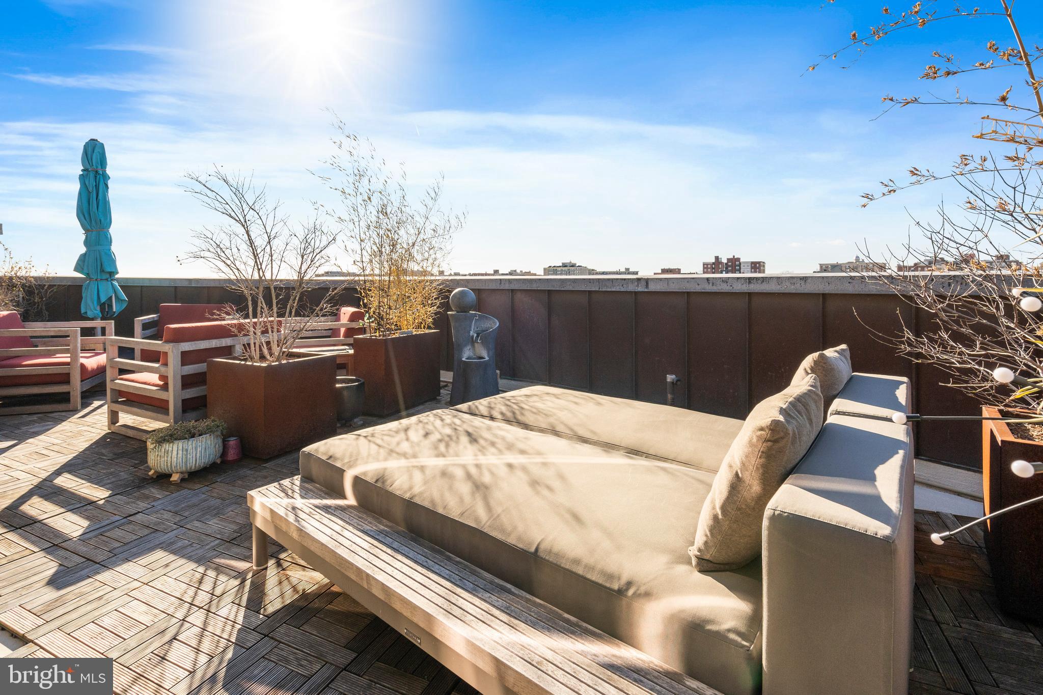 1700 Kalorama Road Northwest, Unit PH502 Washington, DC 20009 - Photo 39 of 50 a terrace of a house with outdoor seating