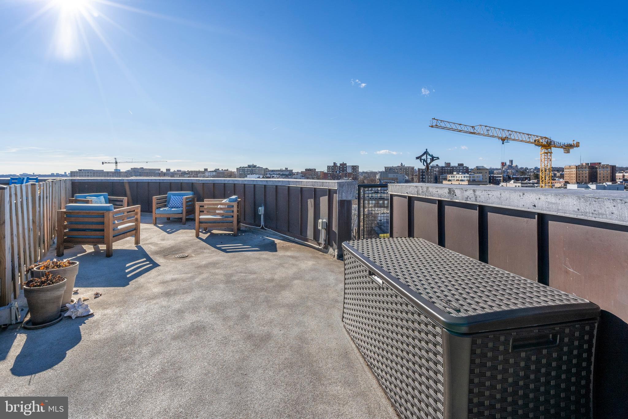 1700 Kalorama Road Northwest, Unit PH502 Washington, DC 20009 - Photo 44 of 50 a dinning table and chairs in the terrace