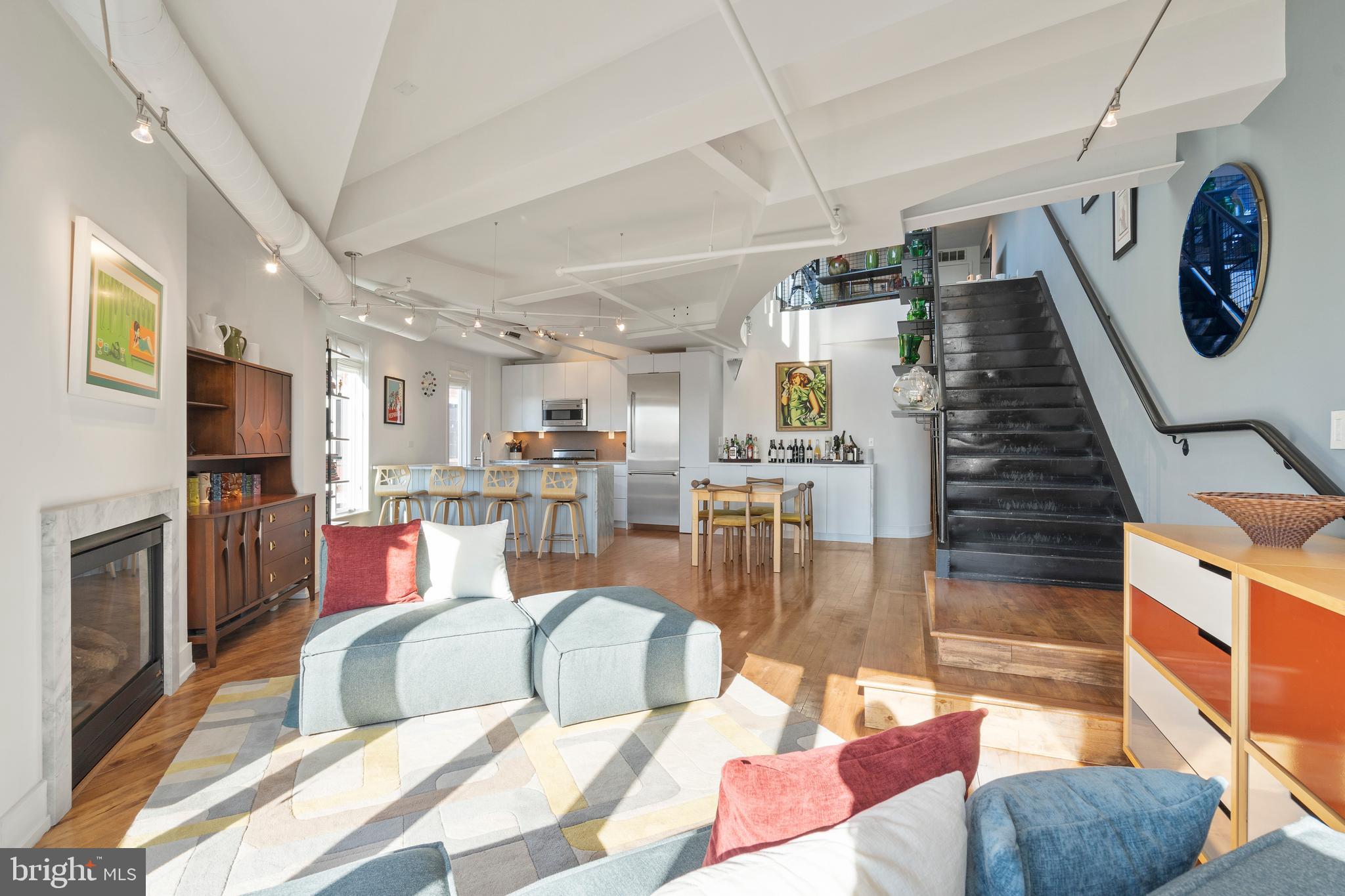 1700 Kalorama Road Northwest, Unit PH502 Washington, DC 20009 - Photo 6 of 50 a living room with furniture and a fireplace