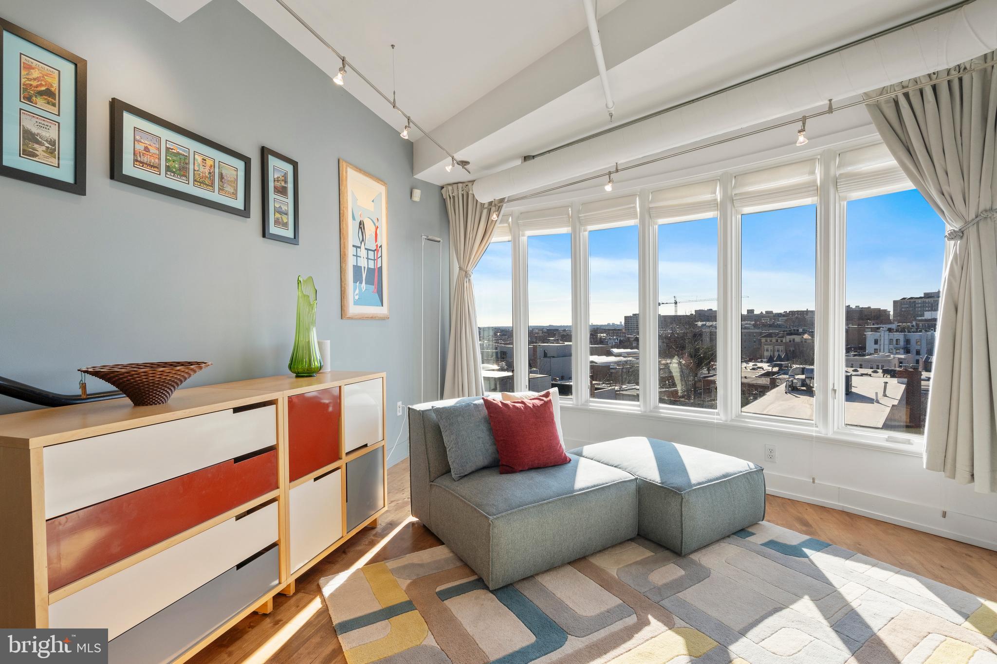 1700 Kalorama Road Northwest, Unit PH502 Washington, DC 20009 - Photo 7 of 50 a living room with furniture and a large window
