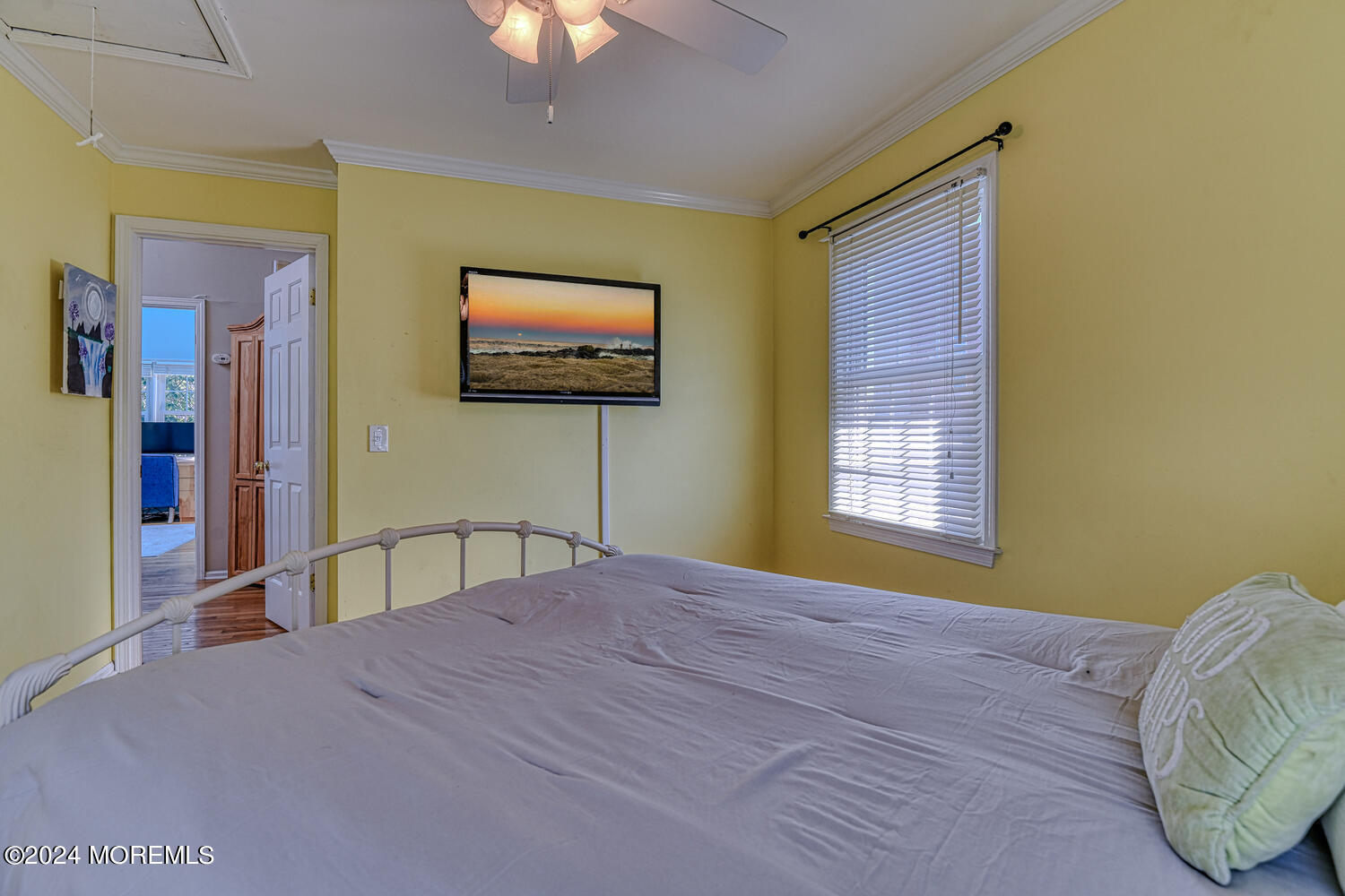82 Inskip Avenue Ocean Grove, NJ 07756 - Photo 25 of 31 a bedroom with a bed and a flat screen tv