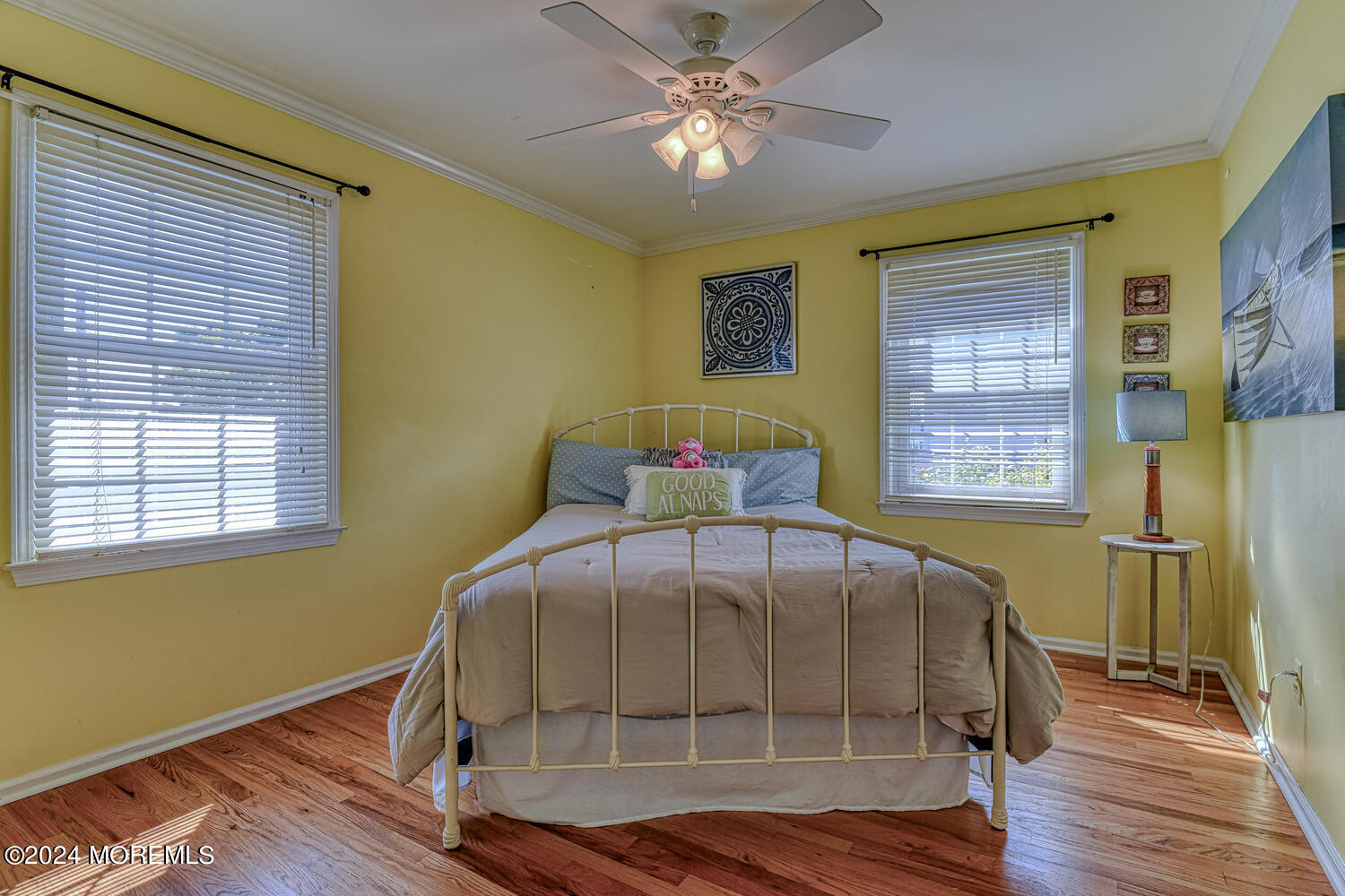 82 Inskip Avenue Ocean Grove, NJ 07756 - Photo 25 of 31 a bedroom with a bed and wooden floor