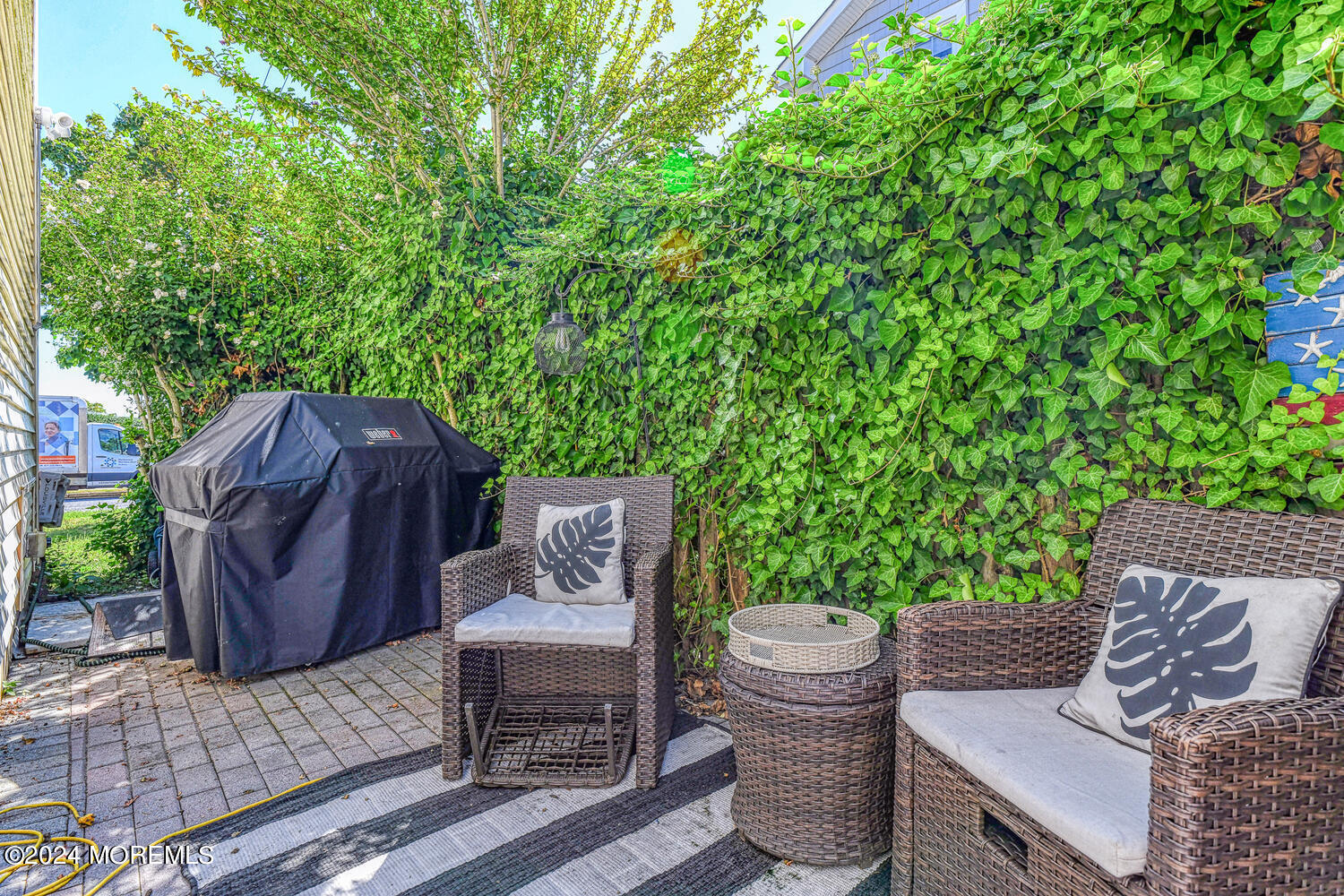 82 Inskip Avenue Ocean Grove, NJ 07756 - Photo 28 of 31 a view of a table and chair in the patio