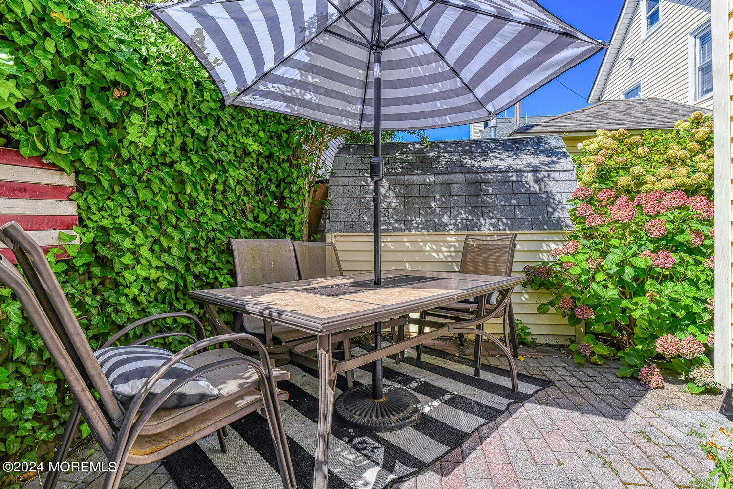 82 Inskip Avenue Ocean Grove, NJ 07756 - Photo 28 of 31 a patio with a table and chairs