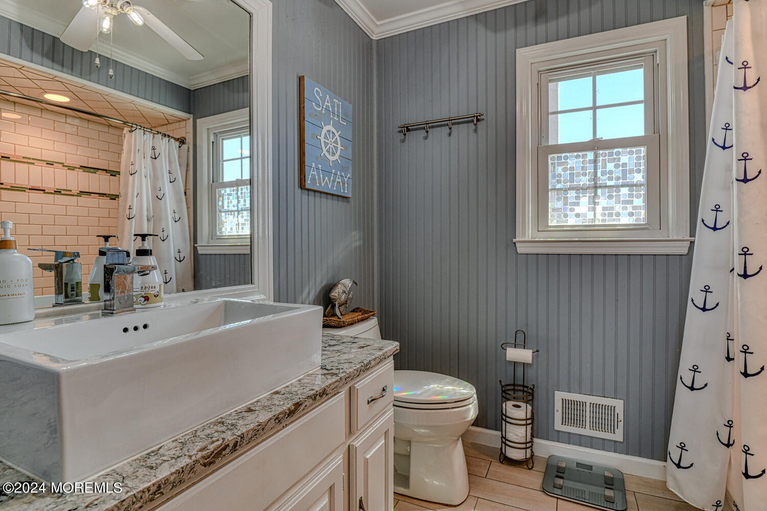 82 Inskip Avenue Ocean Grove, NJ 07756 - Photo 31 of 31 a bath room with a toilet a sink and a bath tub