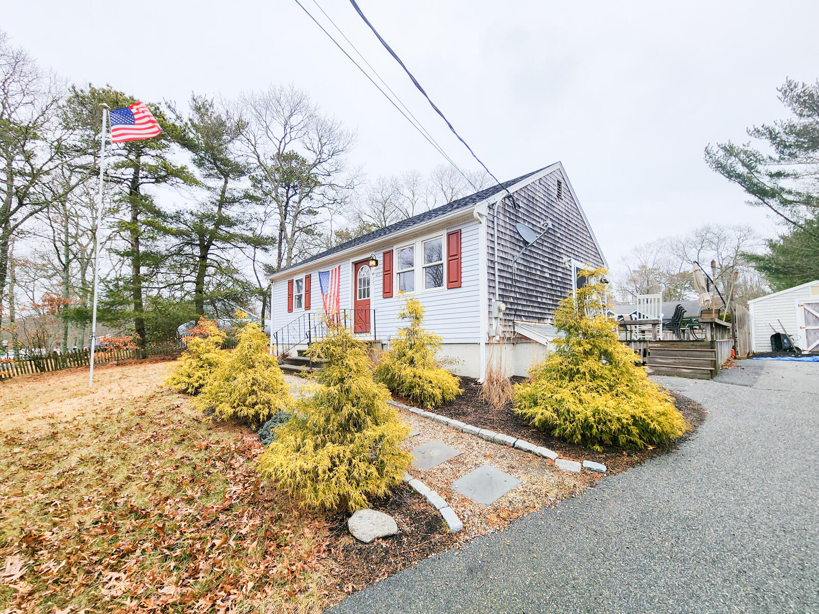 437 Cotuit Road Mashpee, MA 02649 - Photo 1 of 30 a view of a backyard of the house
