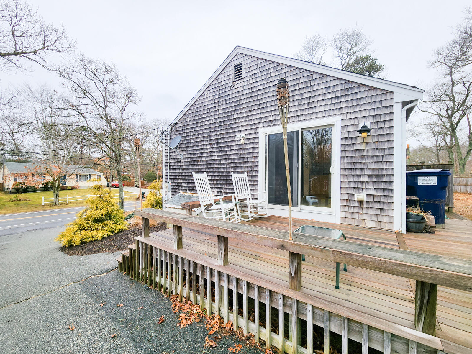 437 Cotuit Road Mashpee, MA 02649 - Photo 19 of 30 a view of a house with wooden floor and outdoor seating