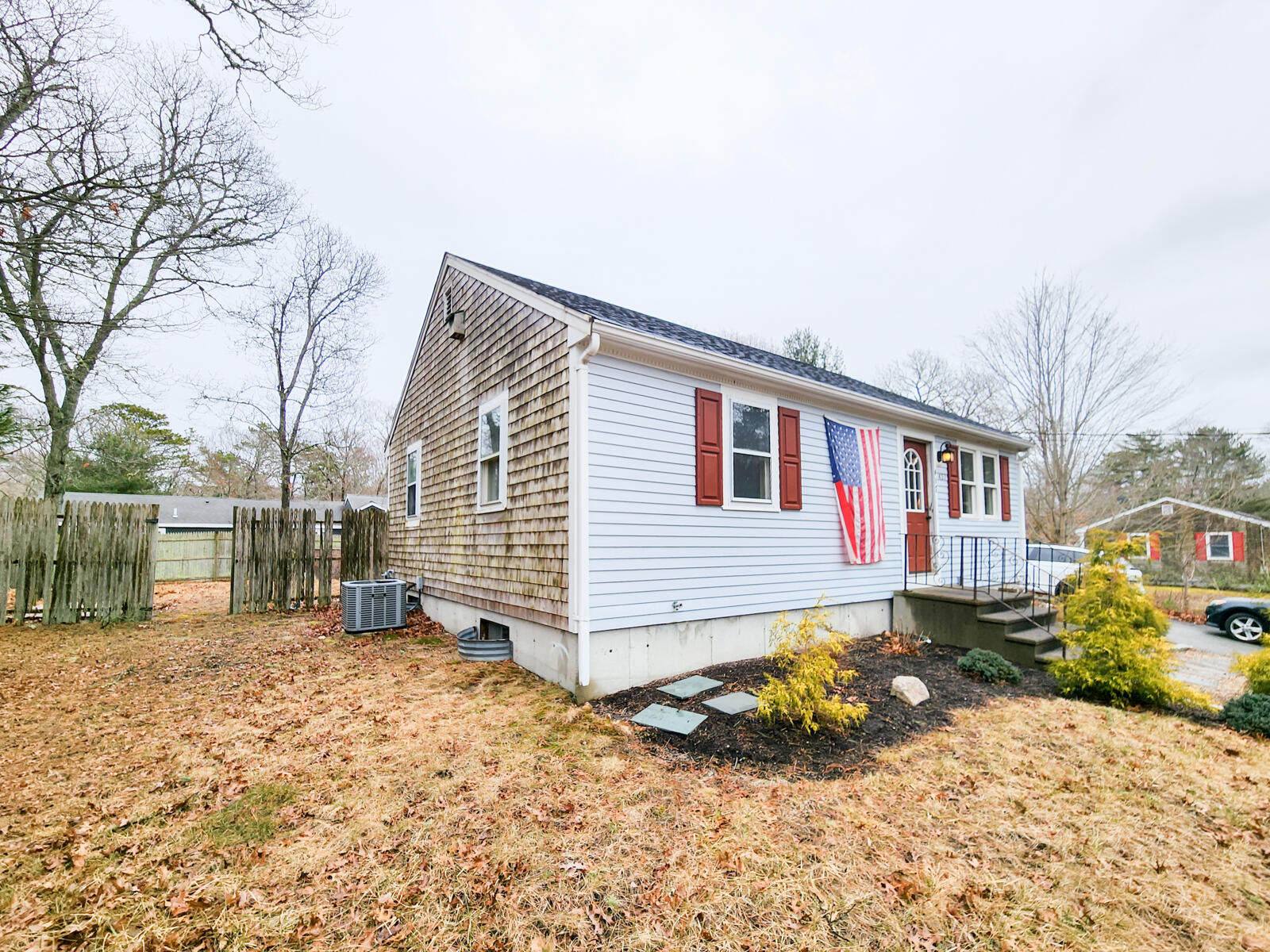 437 Cotuit Road Mashpee, MA 02649 - Photo 23 of 30 a backyard of a house with a yard and seating space