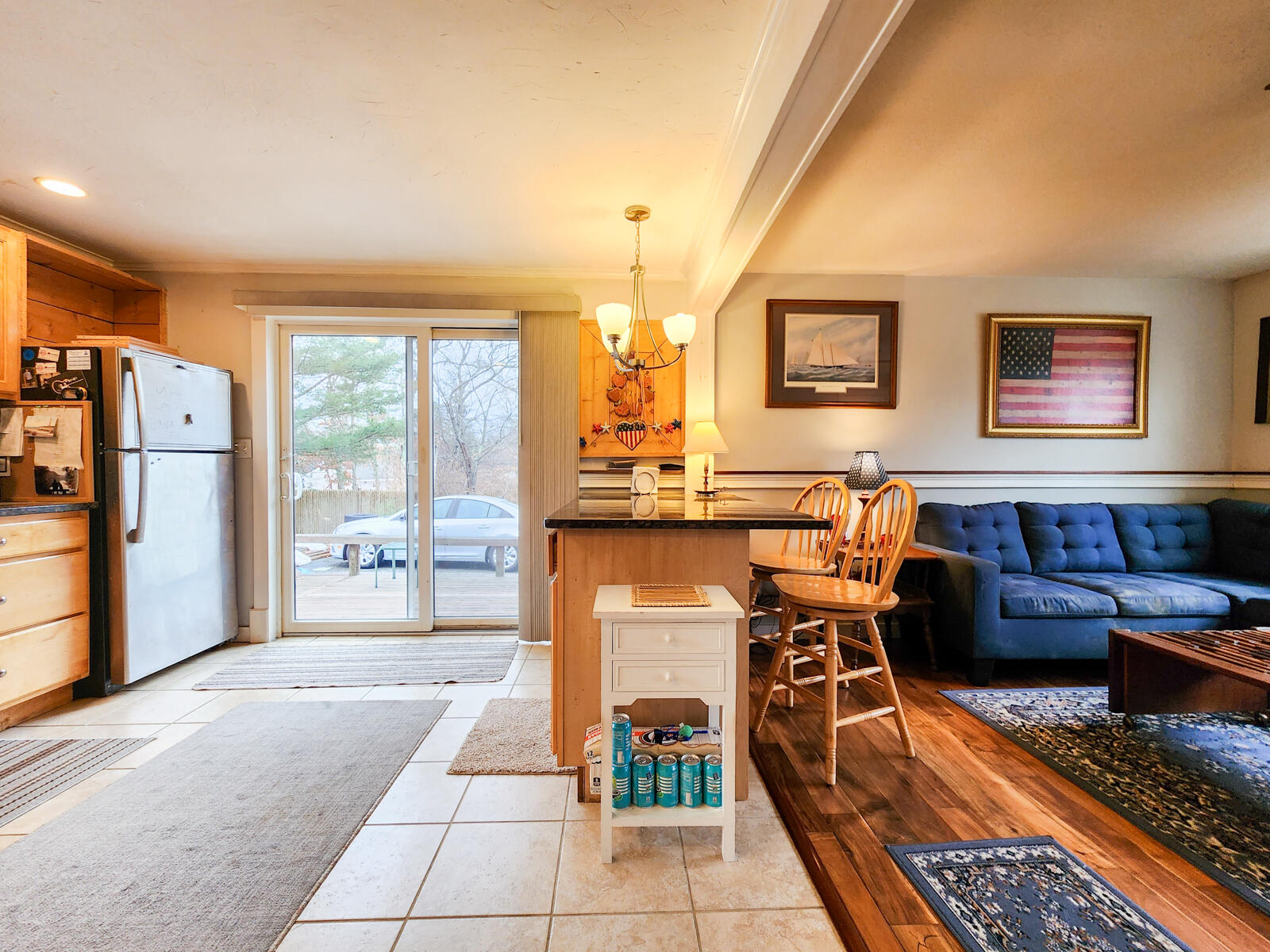 437 Cotuit Road Mashpee, MA 02649 - Photo 6 of 30 a living room with furniture a large window and stainless steel appliances