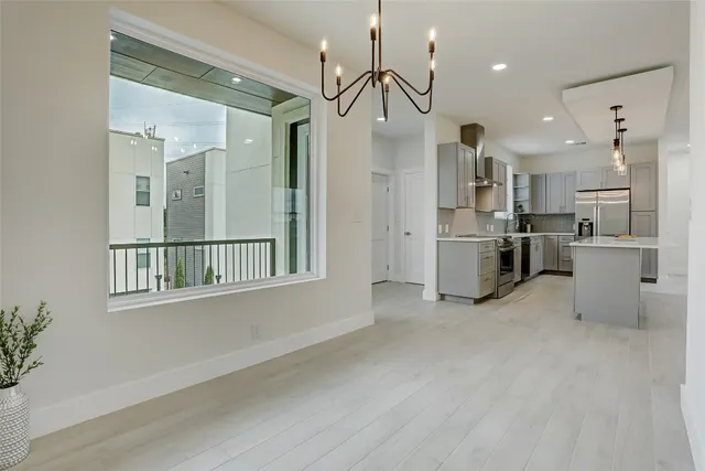 a view of a kitchen with a sink and cabinets
