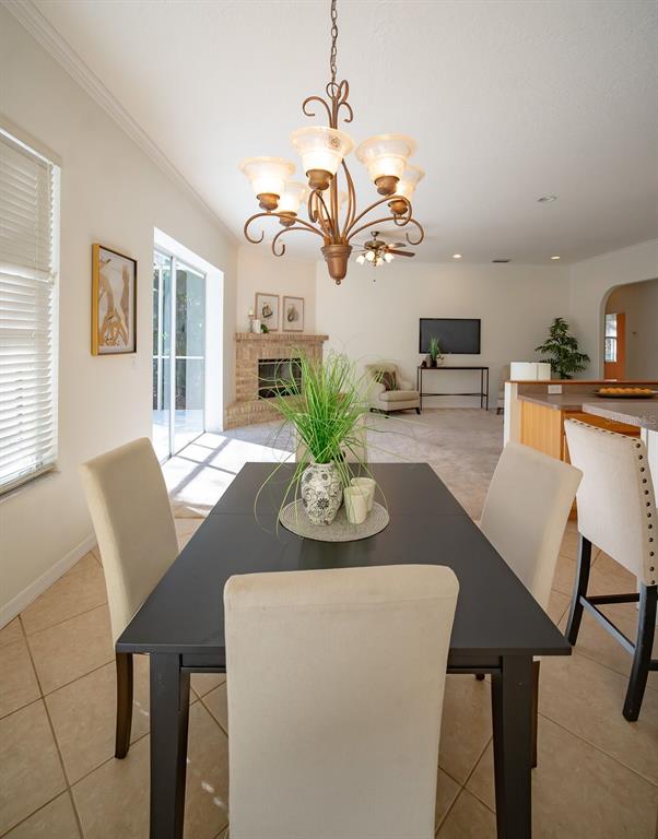 814 Brantenburg Way Lutz, FL 33548 - Photo 11 of 34 a view of a dining room with furniture and a chandelier