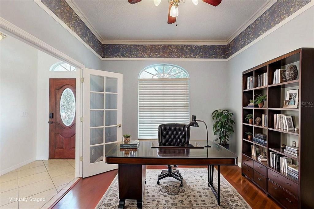 814 Brantenburg Way Lutz, FL 33548 - Photo 12 of 34 a workspace with furniture window and wooden floor