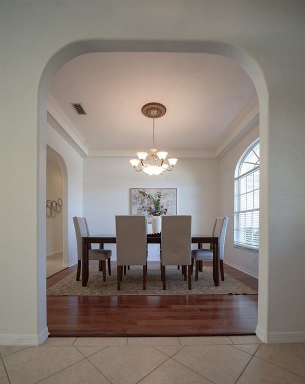 814 Brantenburg Way Lutz, FL 33548 - Photo 13 of 34 a view of a dining room with furniture and chandelier