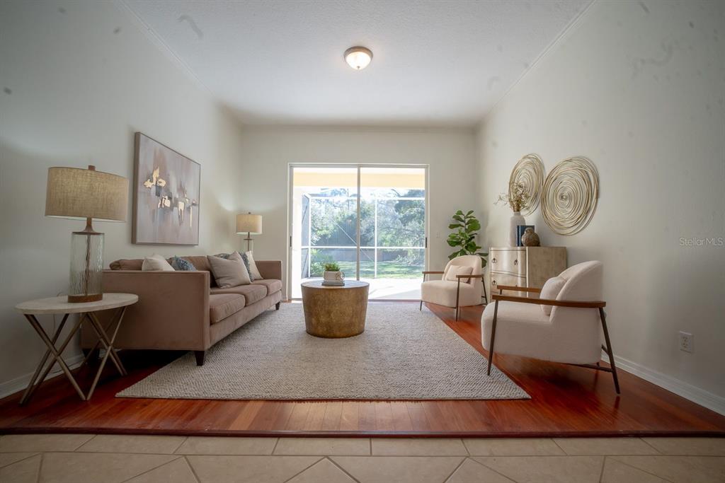 814 Brantenburg Way Lutz, FL 33548 - Photo 15 of 34 a living room with furniture and a window