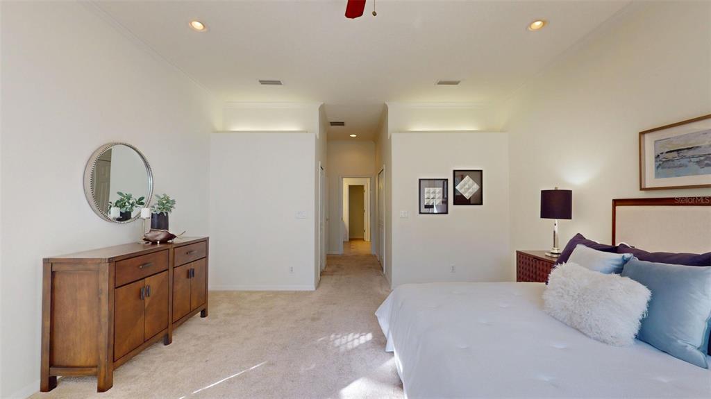 814 Brantenburg Way Lutz, FL 33548 - Photo 16 of 34 a bedroom with a bed and a dresser