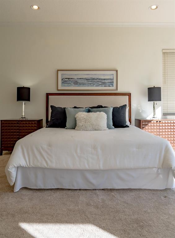 814 Brantenburg Way Lutz, FL 33548 - Photo 18 of 34 a bedroom with a bed and a lamp