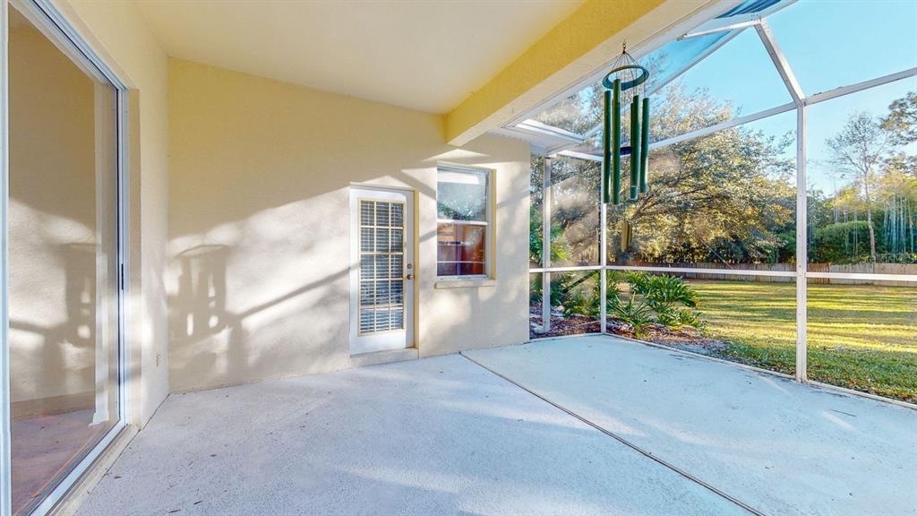 814 Brantenburg Way Lutz, FL 33548 - Photo 29 of 34 a view of an empty room with floor to ceiling windows