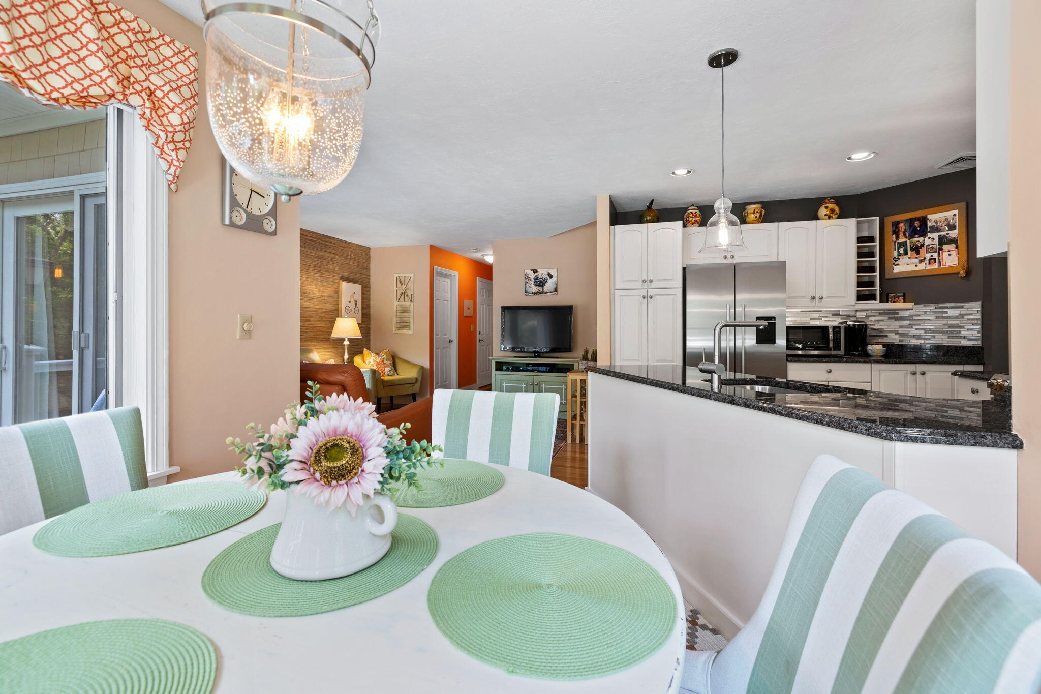 363 Blacksmith Shop Road East Falmouth, MA 02536 - Photo 13 of 40 a kitchen with a table and chairs