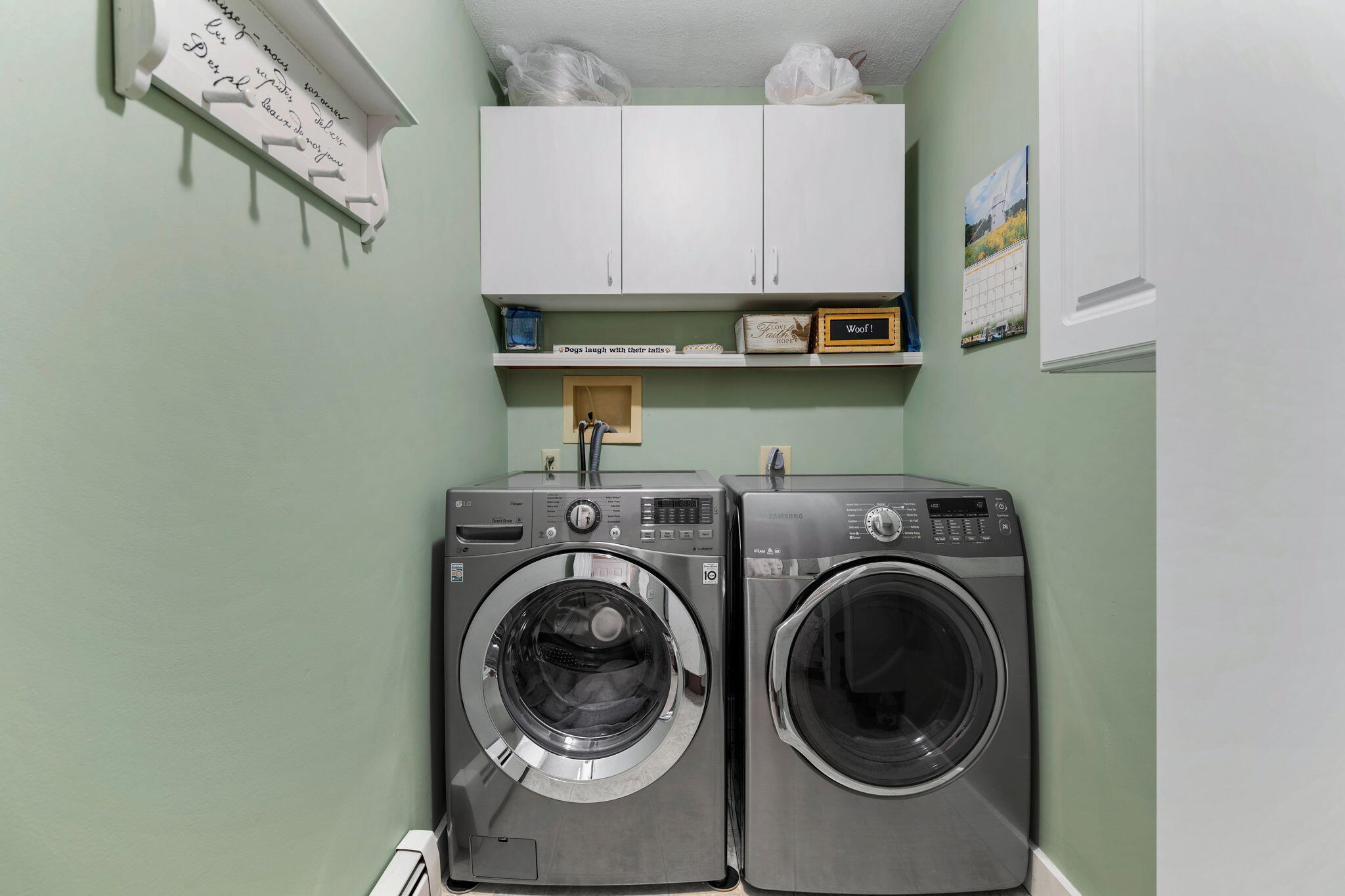 363 Blacksmith Shop Road East Falmouth, MA 02536 - Photo 17 of 40 a view of cabinets and washer in a white refrigerator