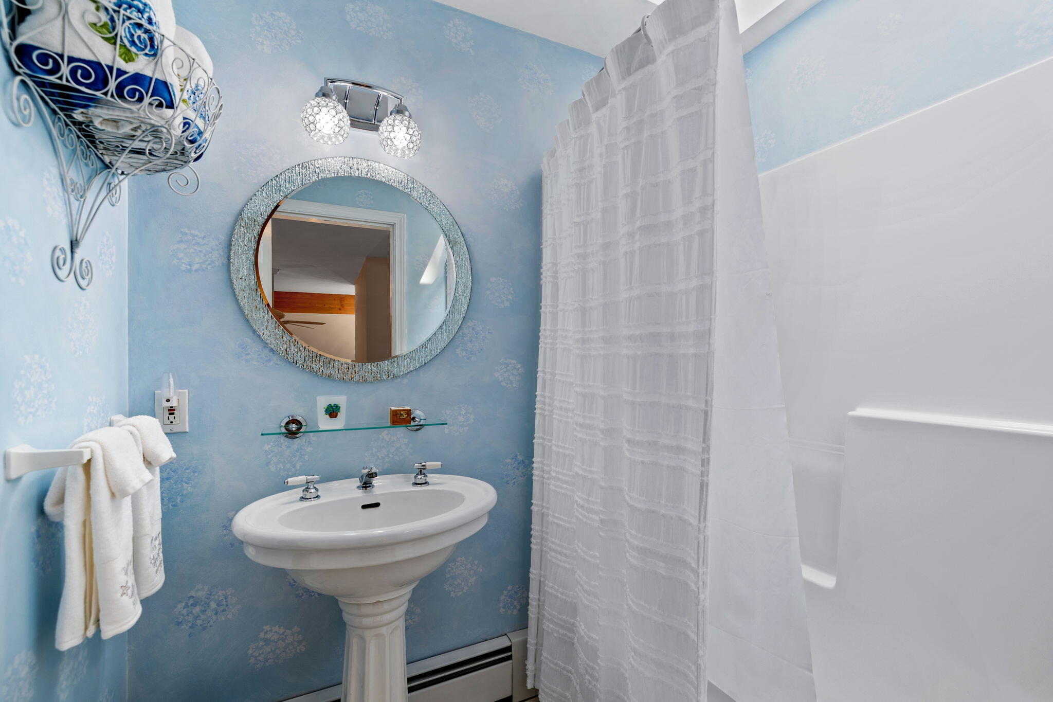 363 Blacksmith Shop Road East Falmouth, MA 02536 - Photo 22 of 40 a bathroom with a sink and a mirror