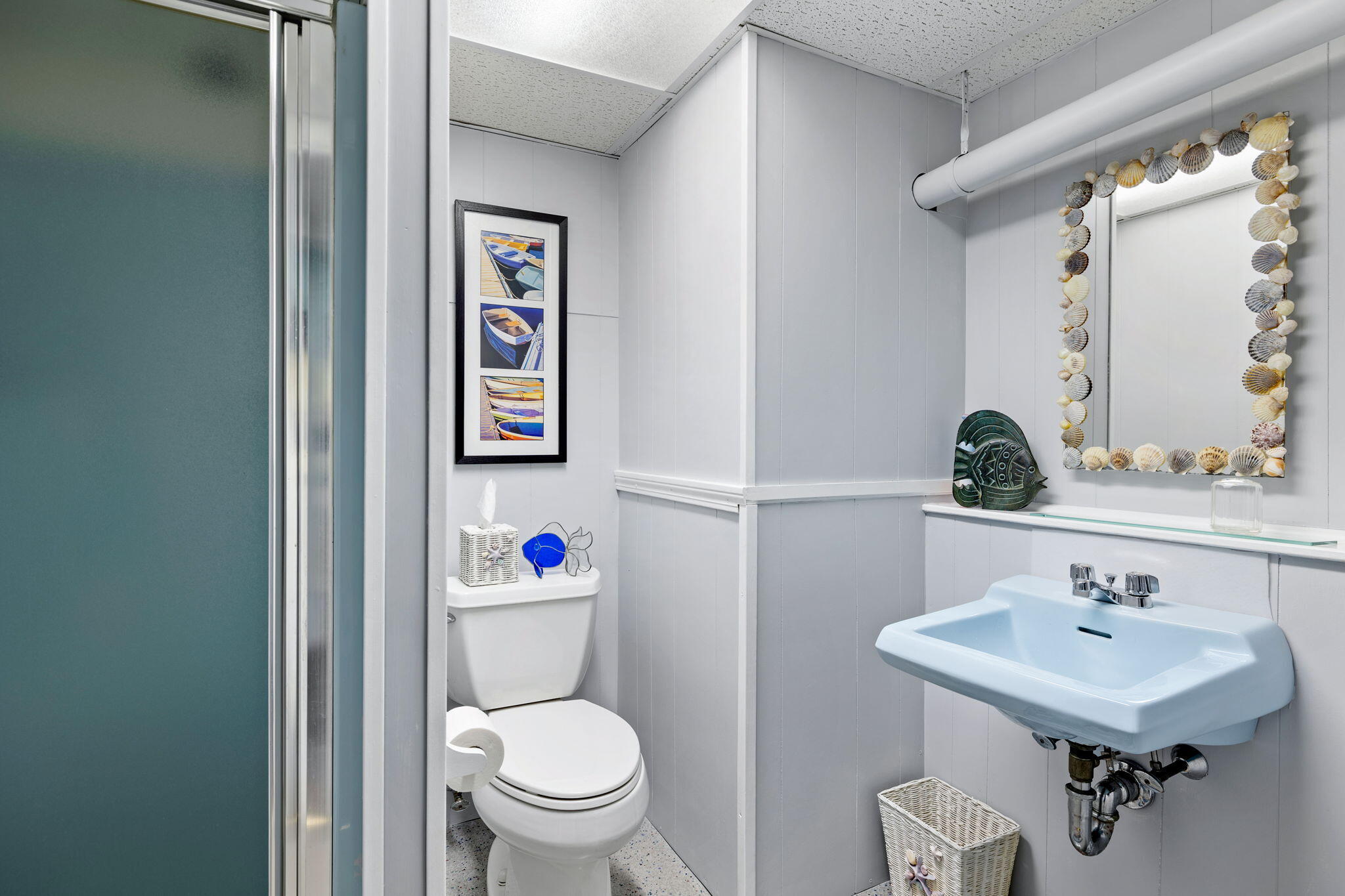 363 Blacksmith Shop Road East Falmouth, MA 02536 - Photo 27 of 40 a bathroom with a sink mirror and toilet