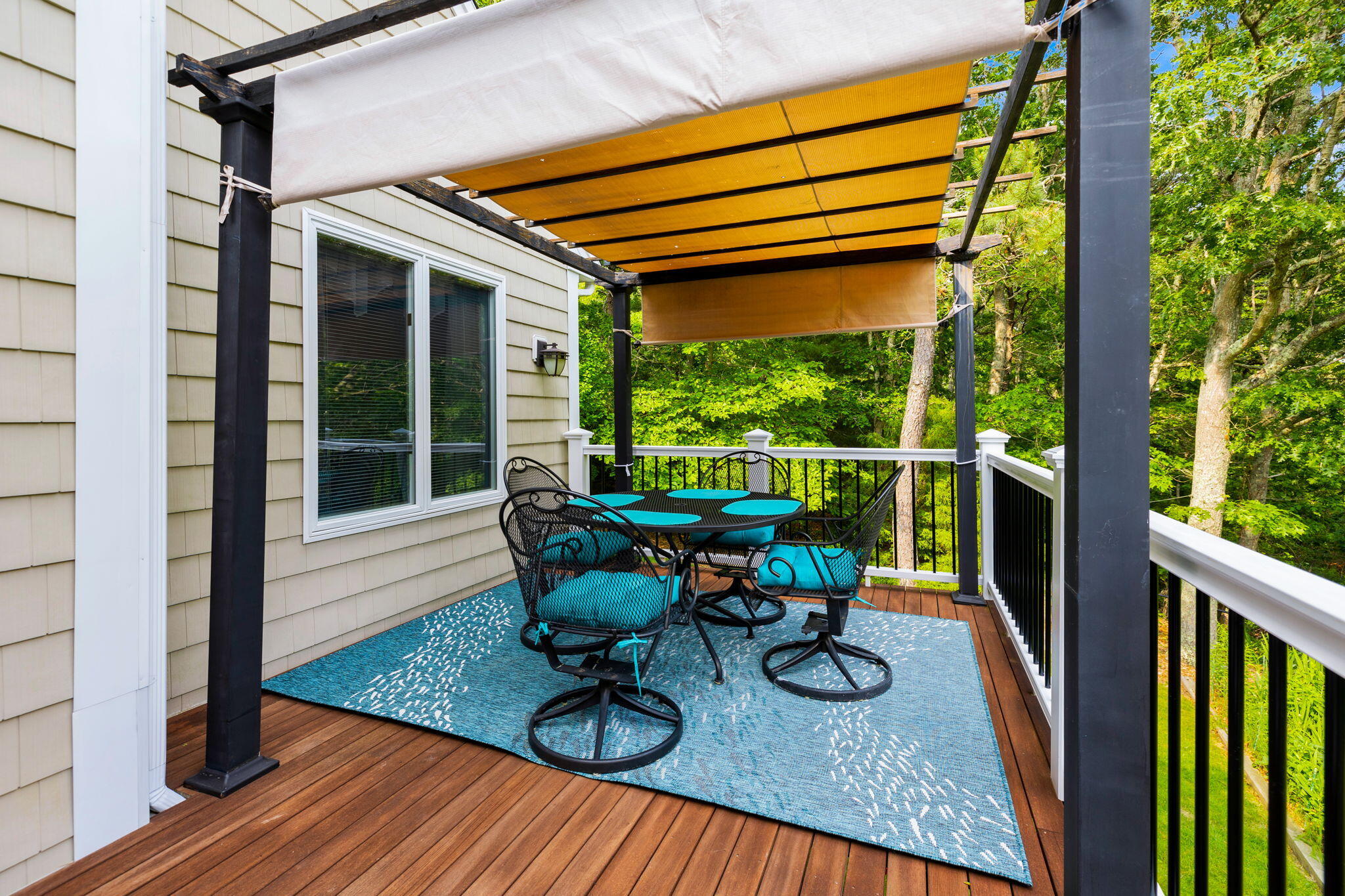 363 Blacksmith Shop Road East Falmouth, MA 02536 - Photo 28 of 40 a view of a chairs and table in the balcony