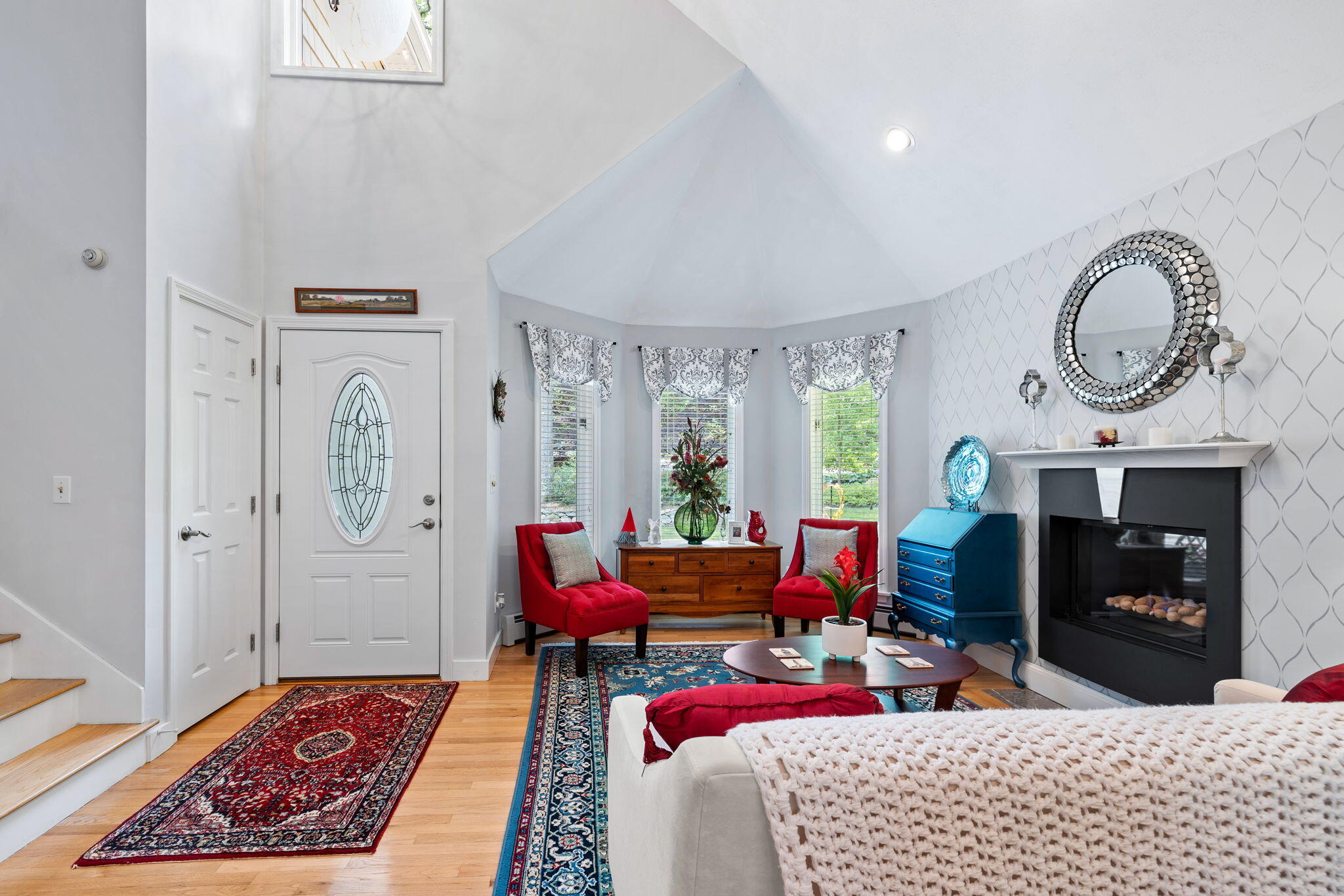 363 Blacksmith Shop Road East Falmouth, MA 02536 - Photo 3 of 40 a living room with furniture a window and a fireplace