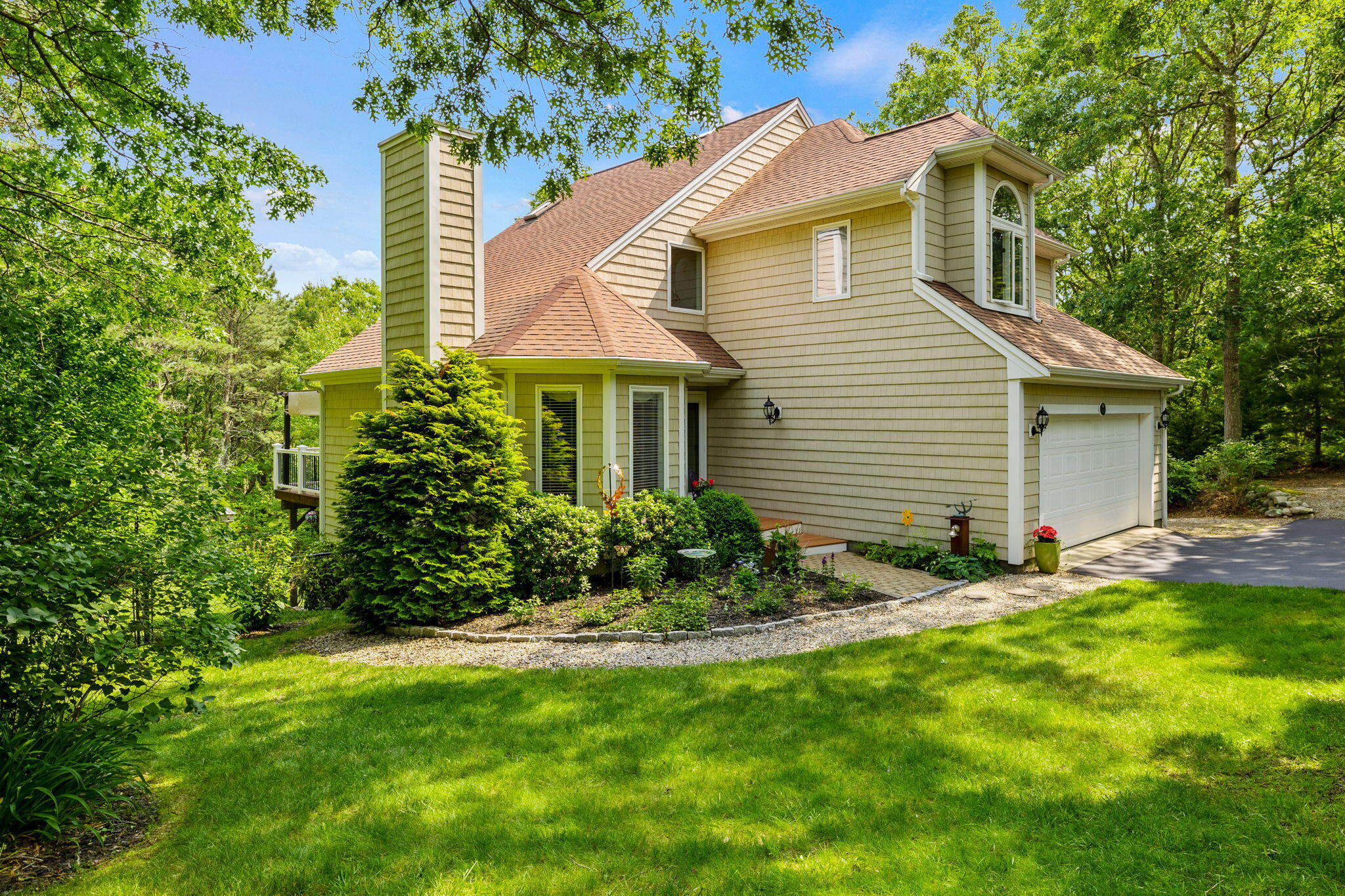 363 Blacksmith Shop Road East Falmouth, MA 02536 - Photo 32 of 40 a view of a house with a yard and plants