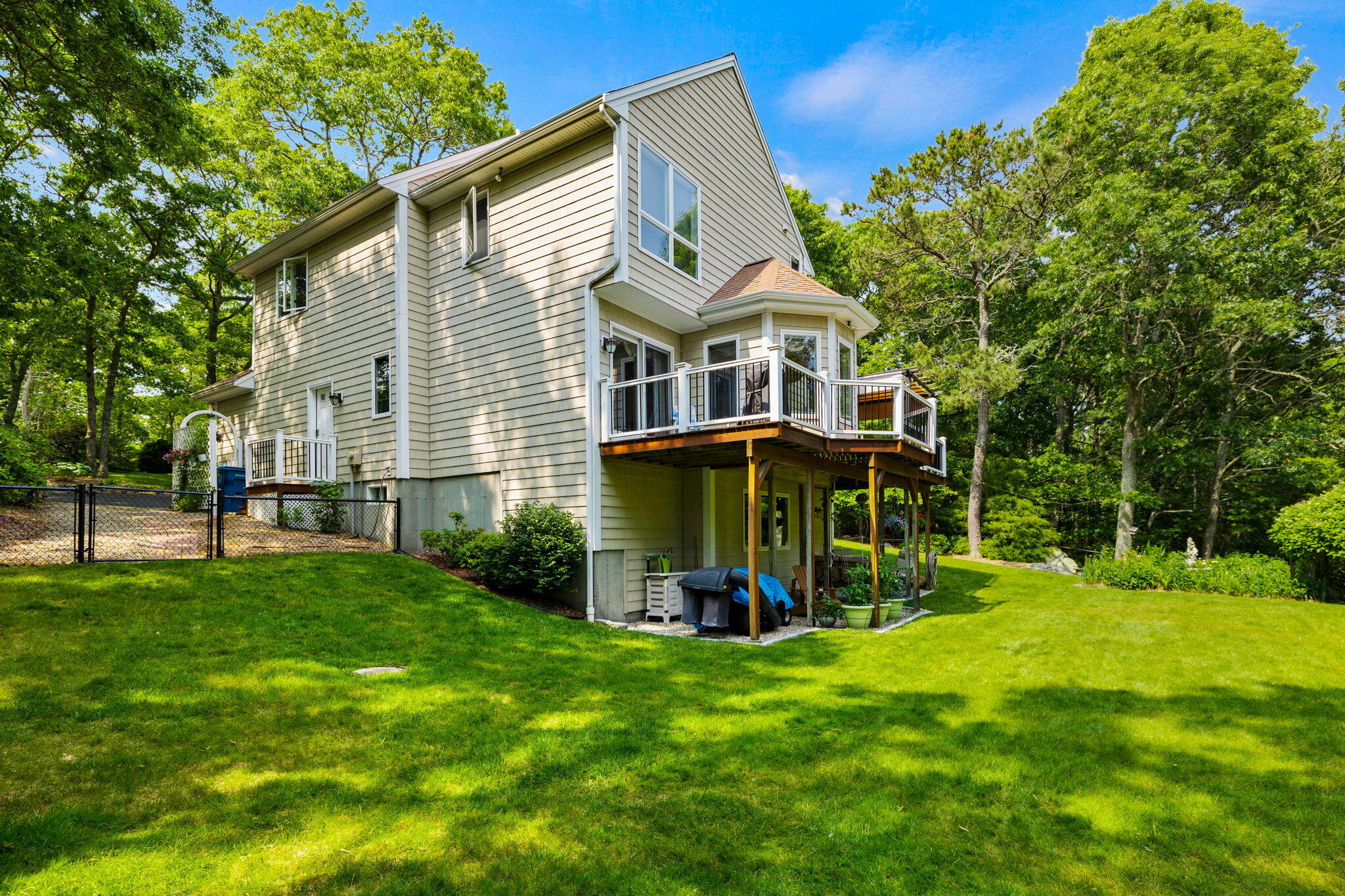 363 Blacksmith Shop Road East Falmouth, MA 02536 - Photo 34 of 40 a view of a house with a yard