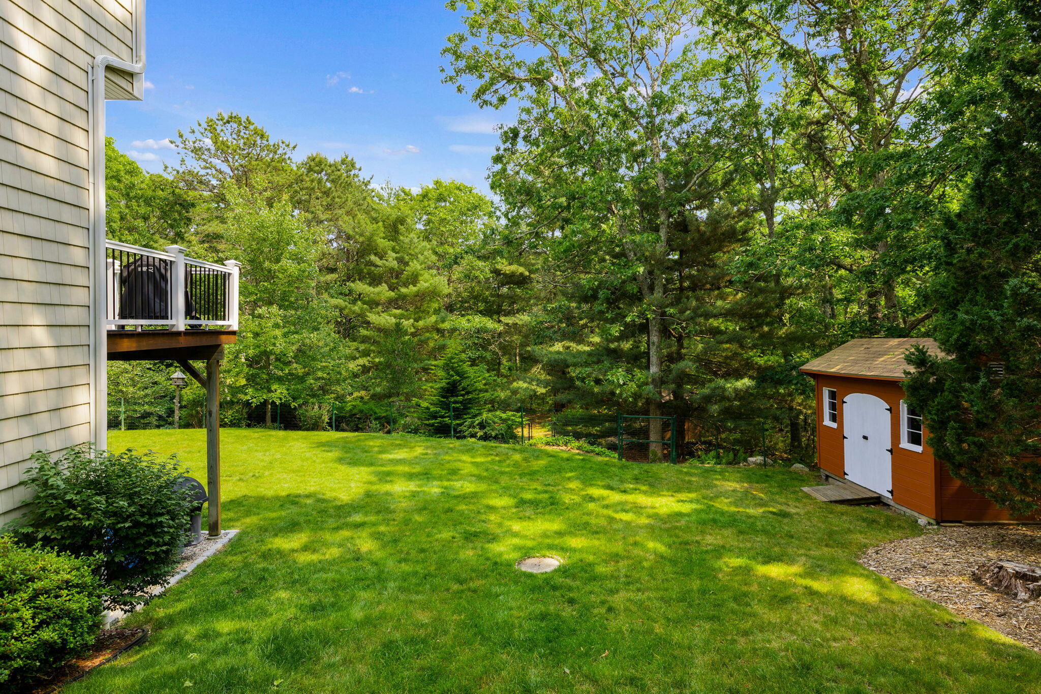 363 Blacksmith Shop Road East Falmouth, MA 02536 - Photo 37 of 40 a view of a house with a backyard