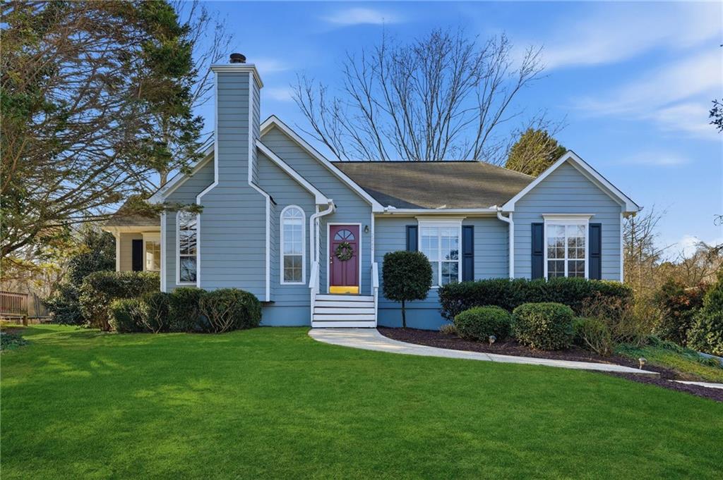 2240 McBrayer Court Cumming, GA 30028 - Photo 1 of 35 a front view of a house with a yard