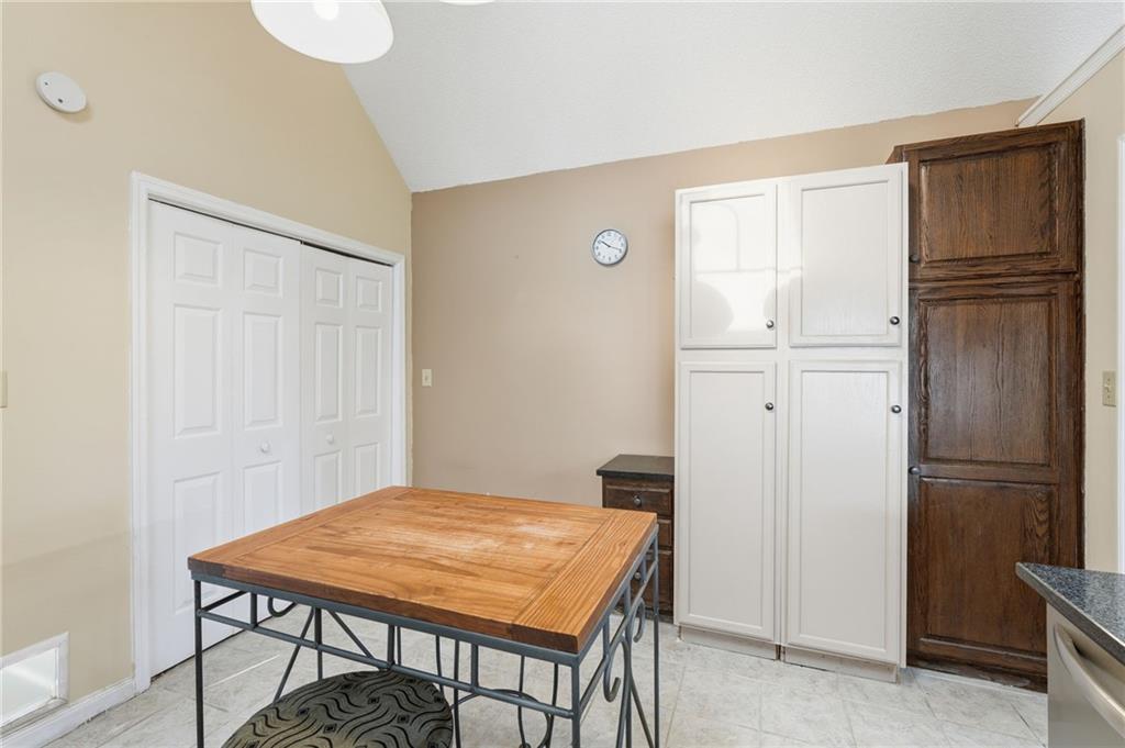 2240 McBrayer Court Cumming, GA 30028 - Photo 13 of 35 a room with a table and chairs