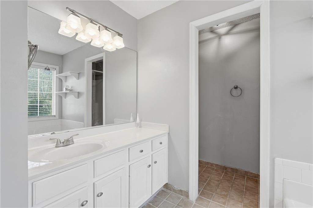 2240 McBrayer Court Cumming, GA 30028 - Photo 19 of 35 a bathroom with a sink double vanity and a mirror