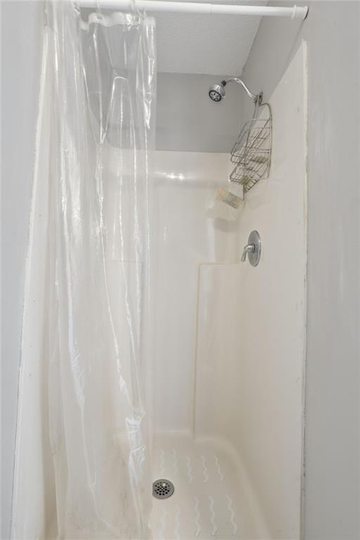 2240 McBrayer Court Cumming, GA 30028 - Photo 20 of 35 a bathroom with a shower