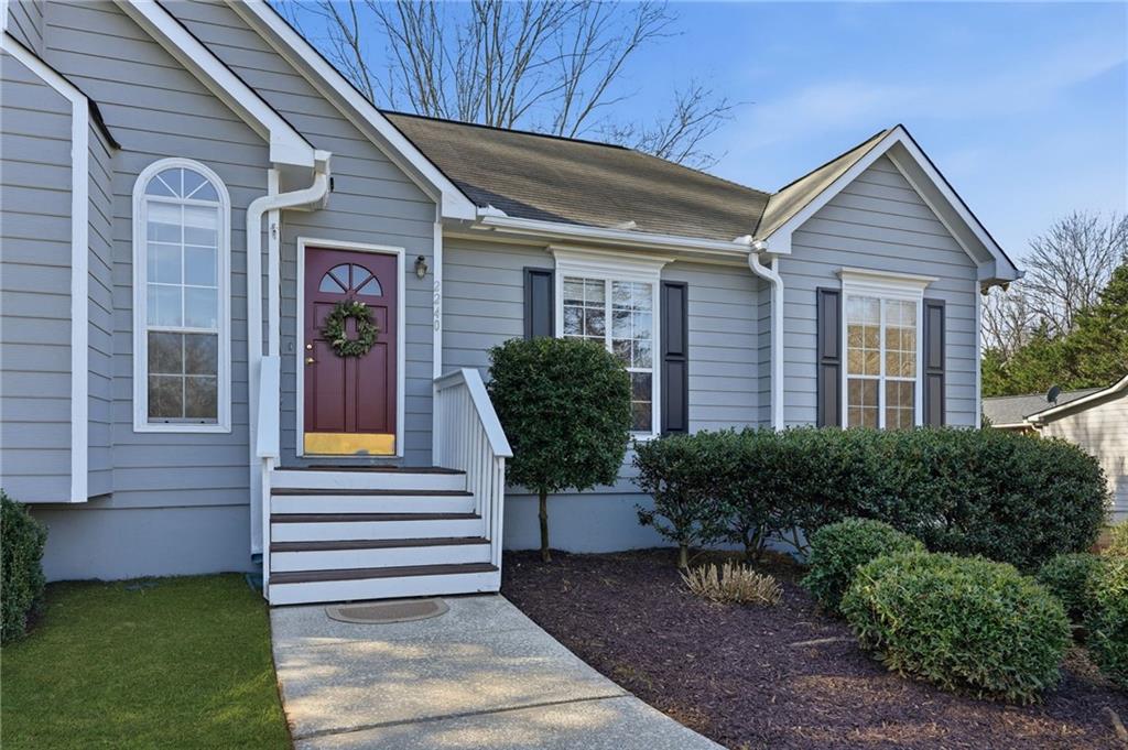 2240 McBrayer Court Cumming, GA 30028 - Photo 2 of 35 a front view of a house with garden