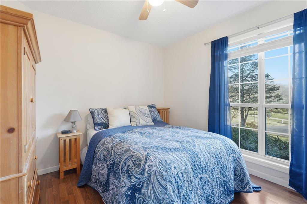 2240 McBrayer Court Cumming, GA 30028 - Photo 21 of 35 a bed sitting in a bedroom next to a window