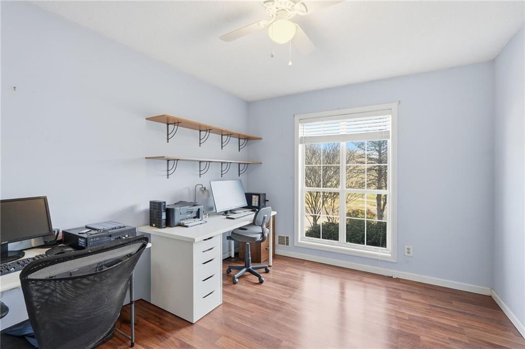 2240 McBrayer Court Cumming, GA 30028 - Photo 22 of 35 a view of a workspace with furniture and a window